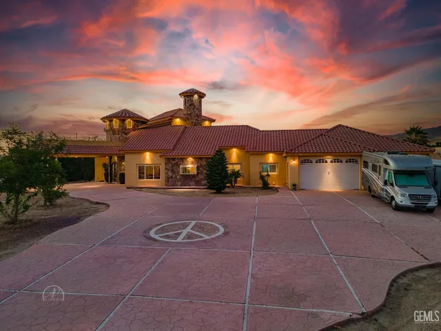 a view of a road with iron fence