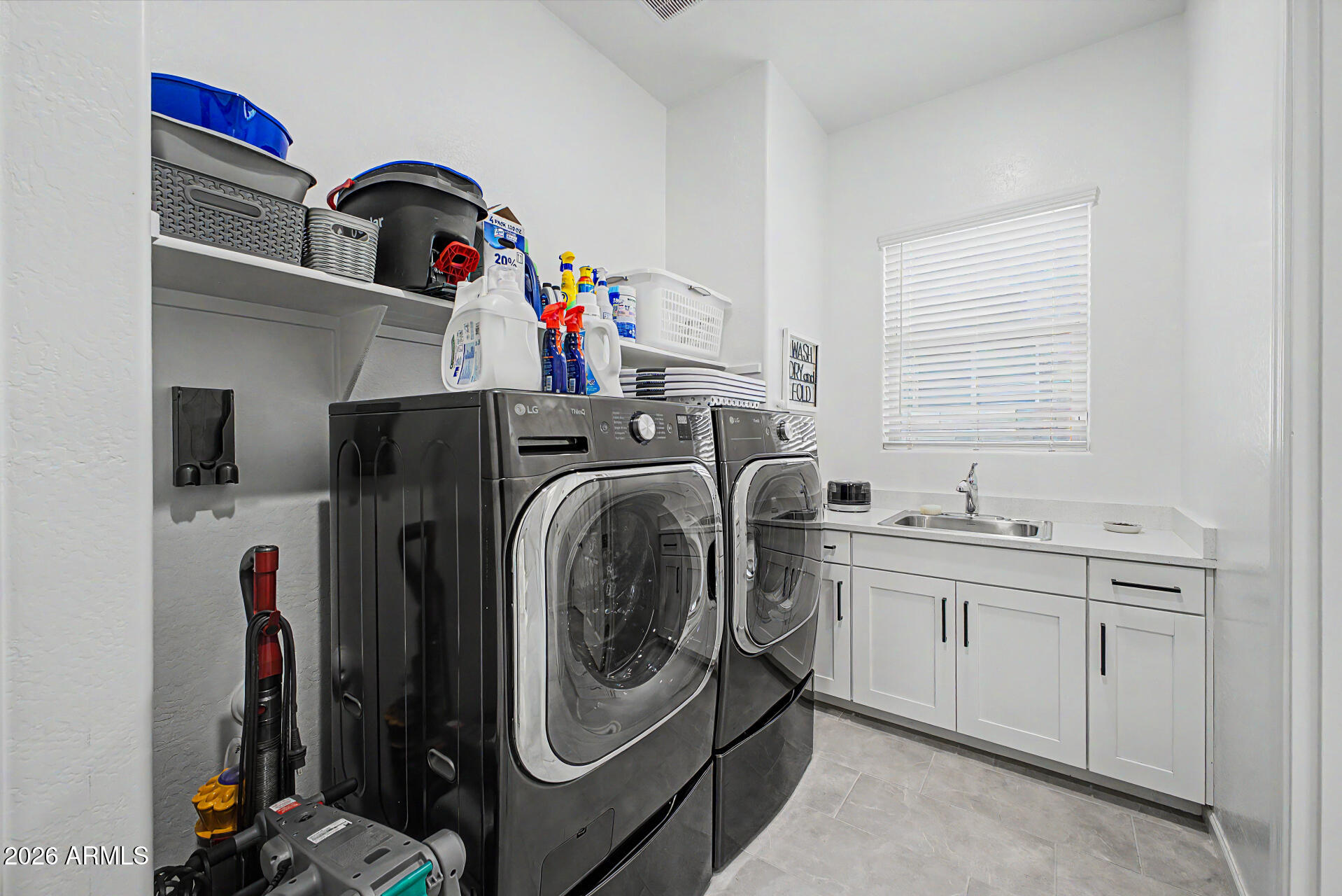 6511 West Steed Ridge Phoenix, AZ 85083 - Photo 31 of 41 a utility room with sink dryer and washer