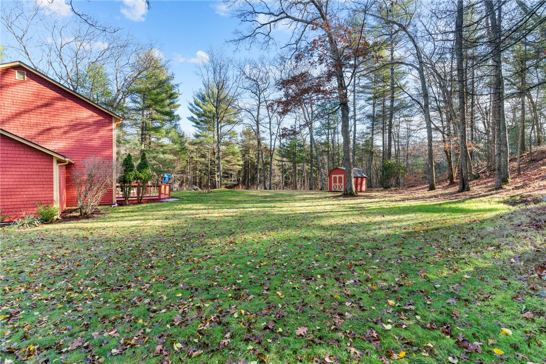 155 Whaley Hollow Road Coventry, RI 02816 - Photo 8 of 31 Flat back yard with endless possibilities! Perhaps a pool??