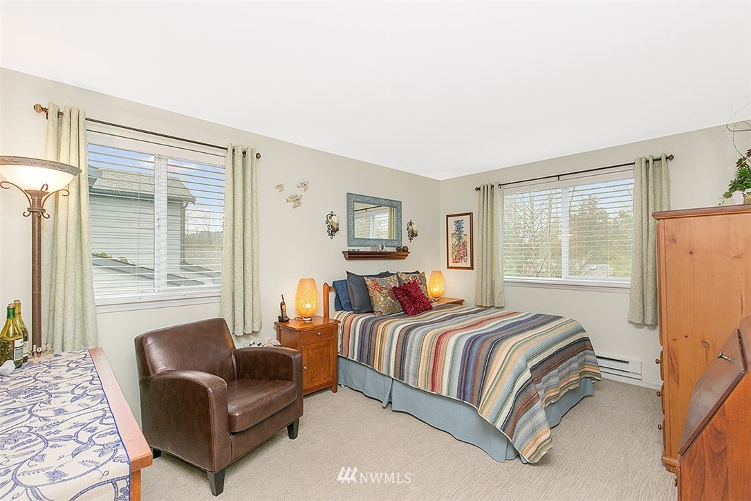 23131 15th Avenue Southeast, Unit H4 Bothell, WA 98021 - Photo 11 of 16 a bedroom with a bed couch and a window