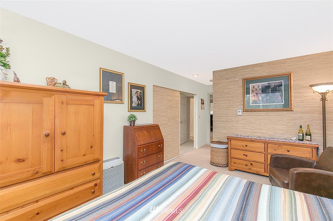 23131 15th Avenue Southeast, Unit H4 Bothell, WA 98021 - Photo 12 of 16 a spacious bedroom with a bed and wooden floor