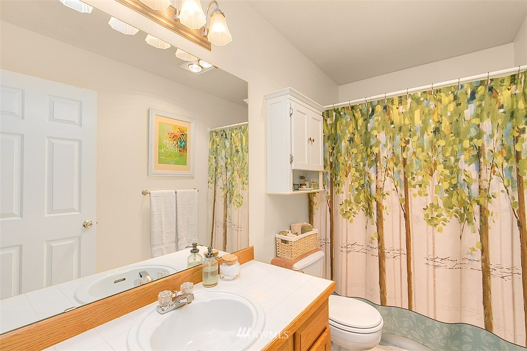 23131 15th Avenue Southeast, Unit H4 Bothell, WA 98021 - Photo 13 of 16 a spacious bathroom with a double vanity sink toilet and shower