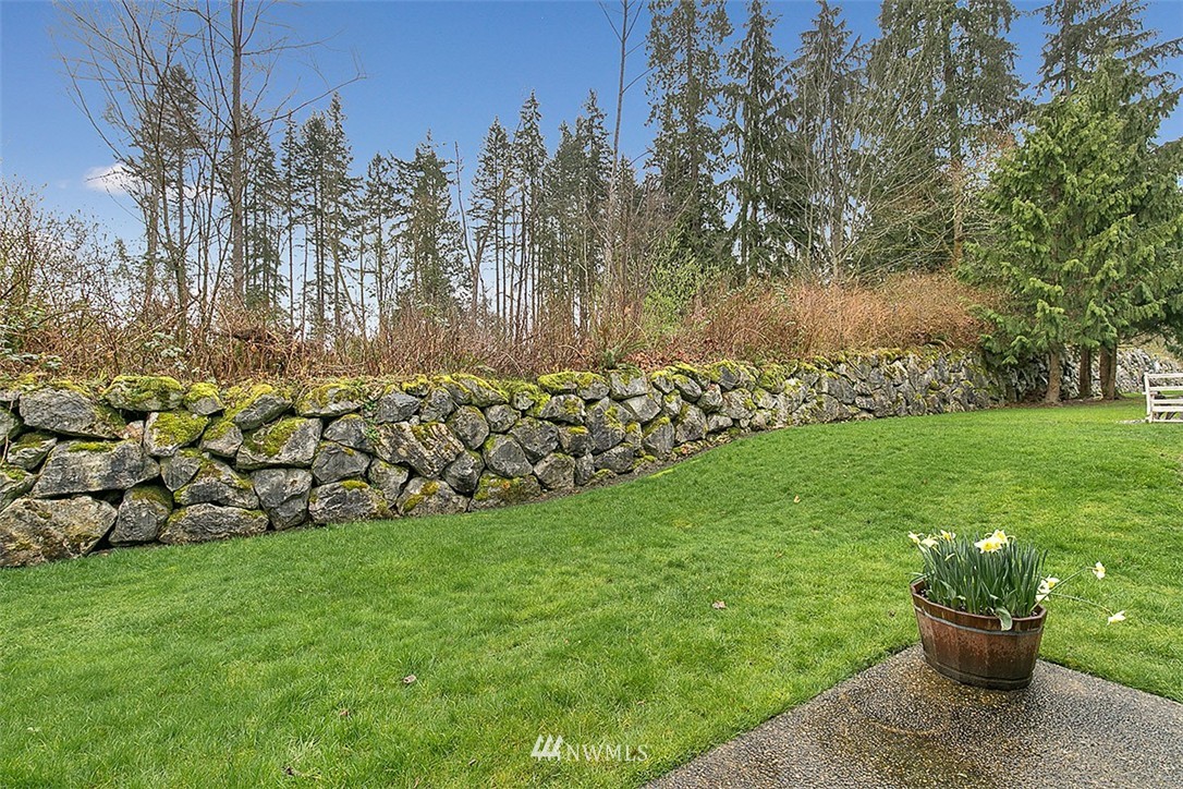 23131 15th Avenue Southeast, Unit H4 Bothell, WA 98021 - Photo 16 of 16 a view of a backyard with plants and a garden