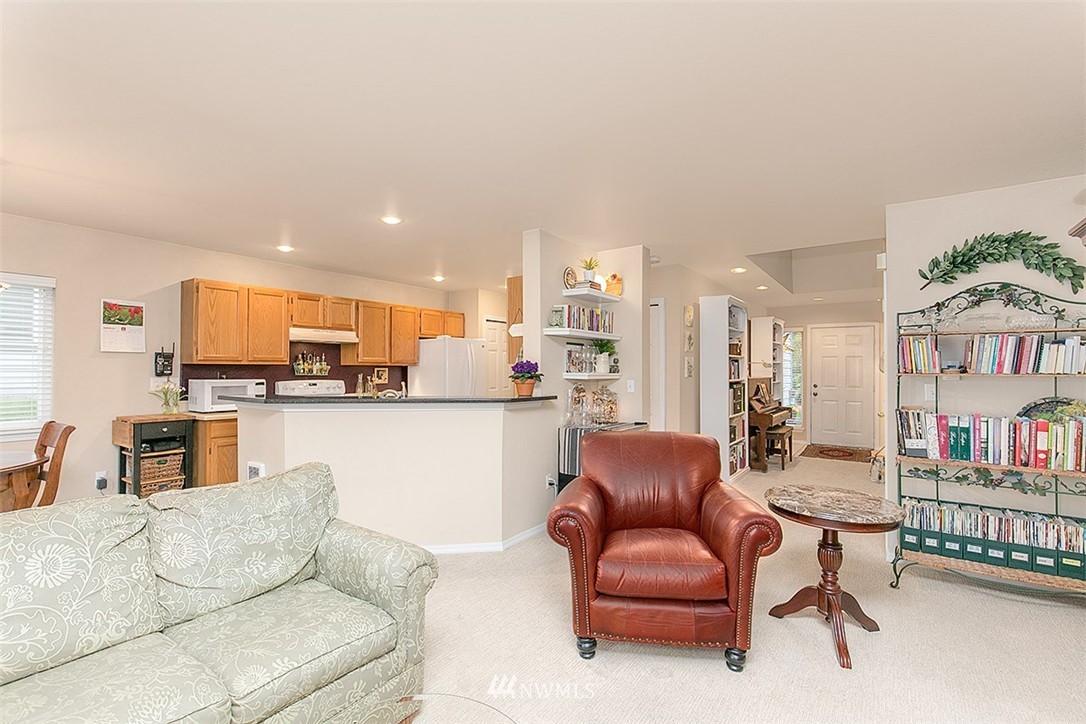 23131 15th Avenue Southeast, Unit H4 Bothell, WA 98021 - Photo 3 of 16 a living room with furniture kitchen view and a potted plant