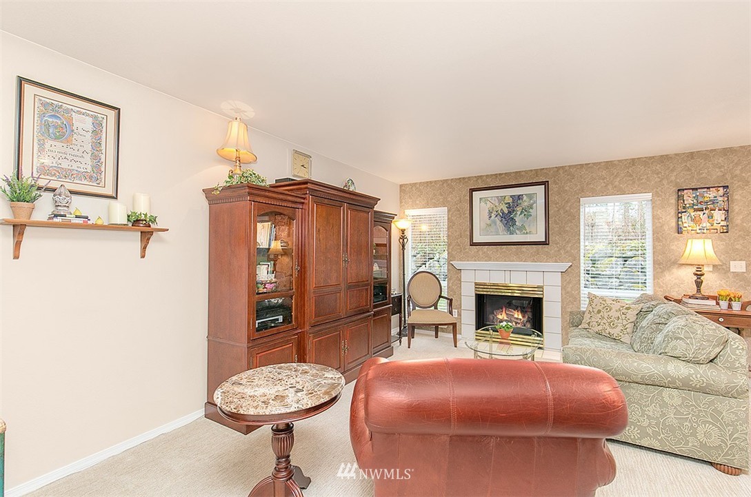 23131 15th Avenue Southeast, Unit H4 Bothell, WA 98021 - Photo 4 of 16 a living room with furniture and a fireplace