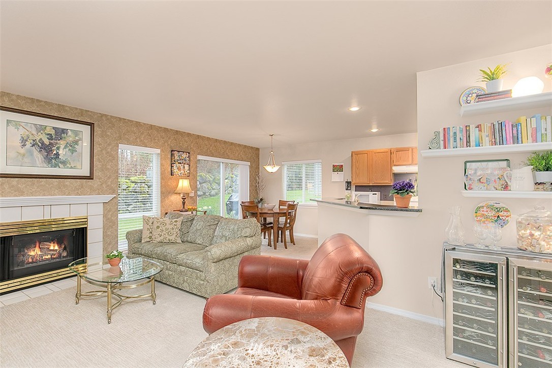 23131 15th Avenue Southeast, Unit H4 Bothell, WA 98021 - Photo 5 of 16 a living room with furniture and a fireplace