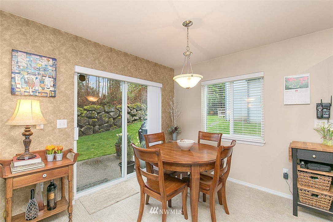 23131 15th Avenue Southeast, Unit H4 Bothell, WA 98021 - Photo 6 of 16 a view of a dining room with furniture window and outside view