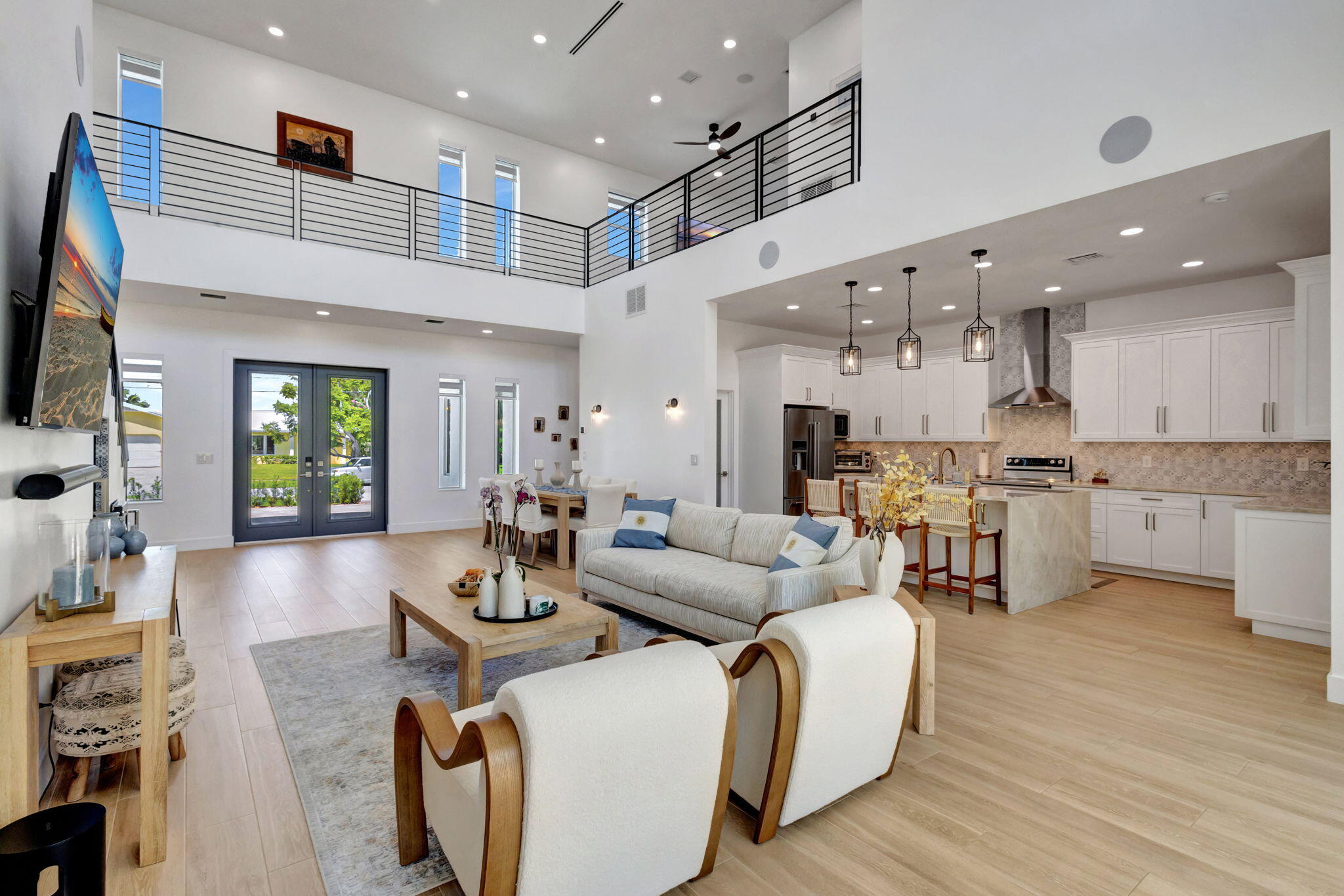 12952 Drayton Road North Palm Beach, FL 33408 - Photo 31 of 109 a living room with furniture kitchen view and a wooden floor