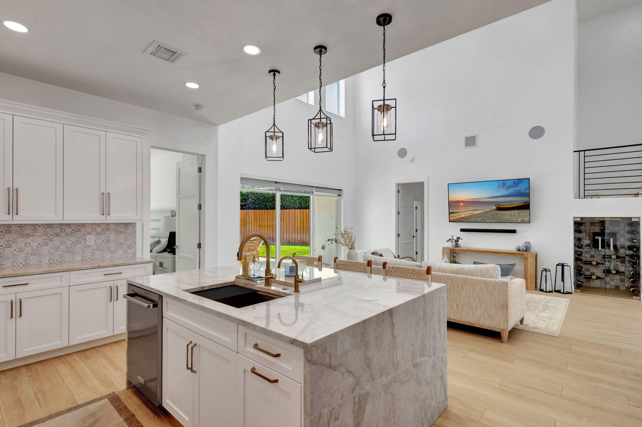 12952 Drayton Road North Palm Beach, FL 33408 - Photo 39 of 109 a kitchen with stainless steel appliances kitchen island granite countertop a sink and a white cabinets