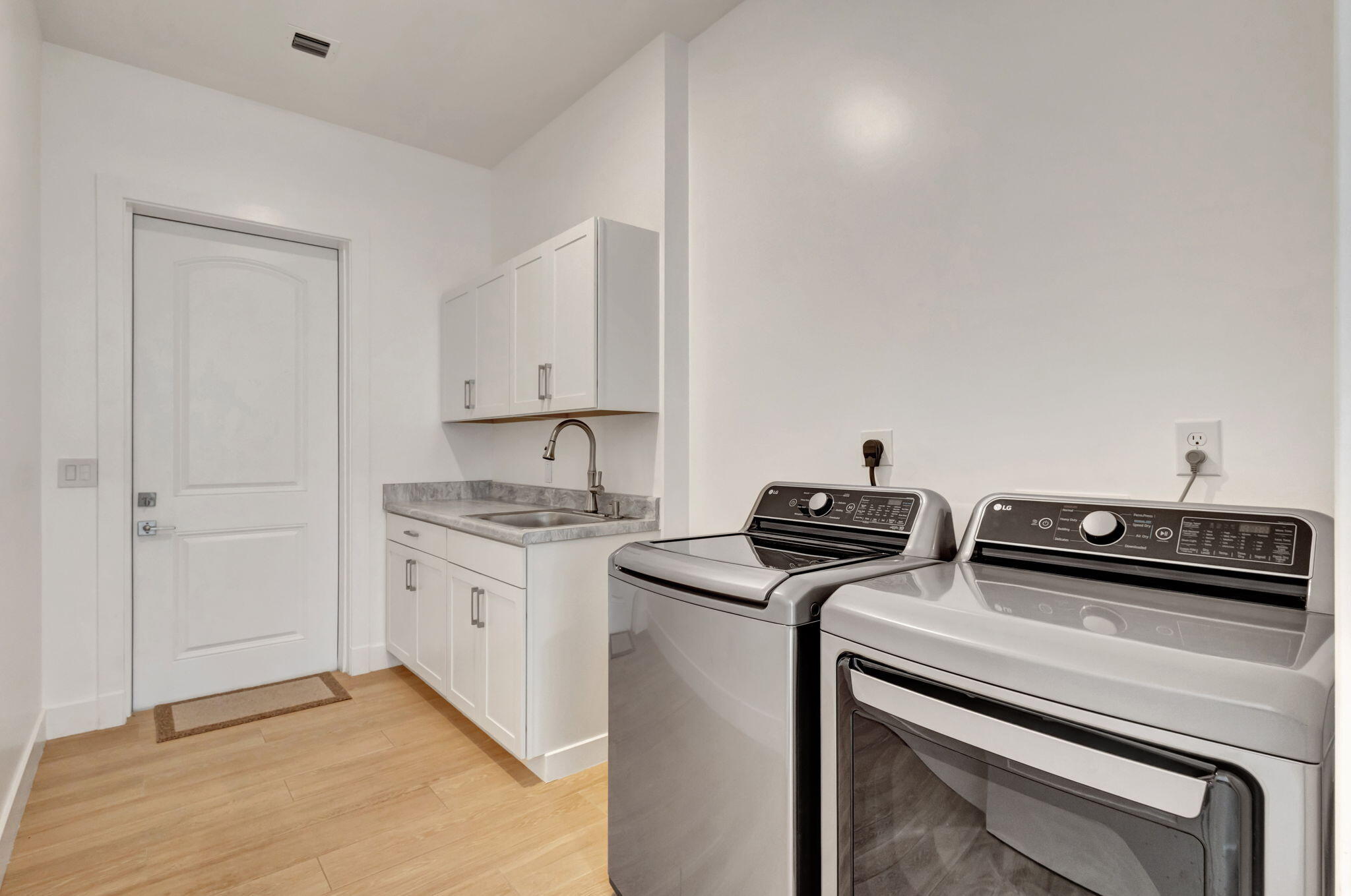 12952 Drayton Road North Palm Beach, FL 33408 - Photo 41 of 109 a view of storage and utility room with washer and dryer