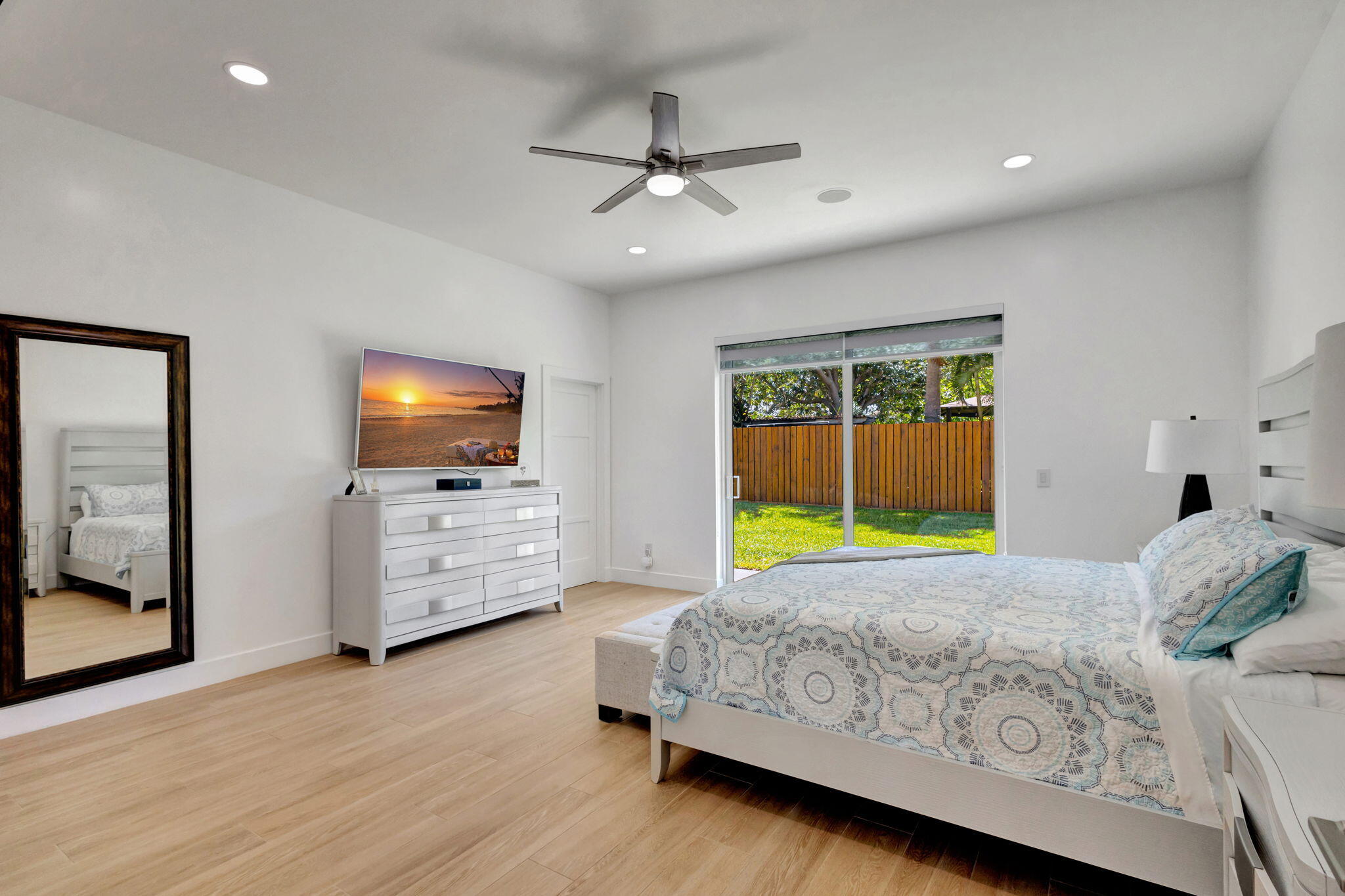 12952 Drayton Road North Palm Beach, FL 33408 - Photo 45 of 109 a bedroom with a bed and a flat screen tv