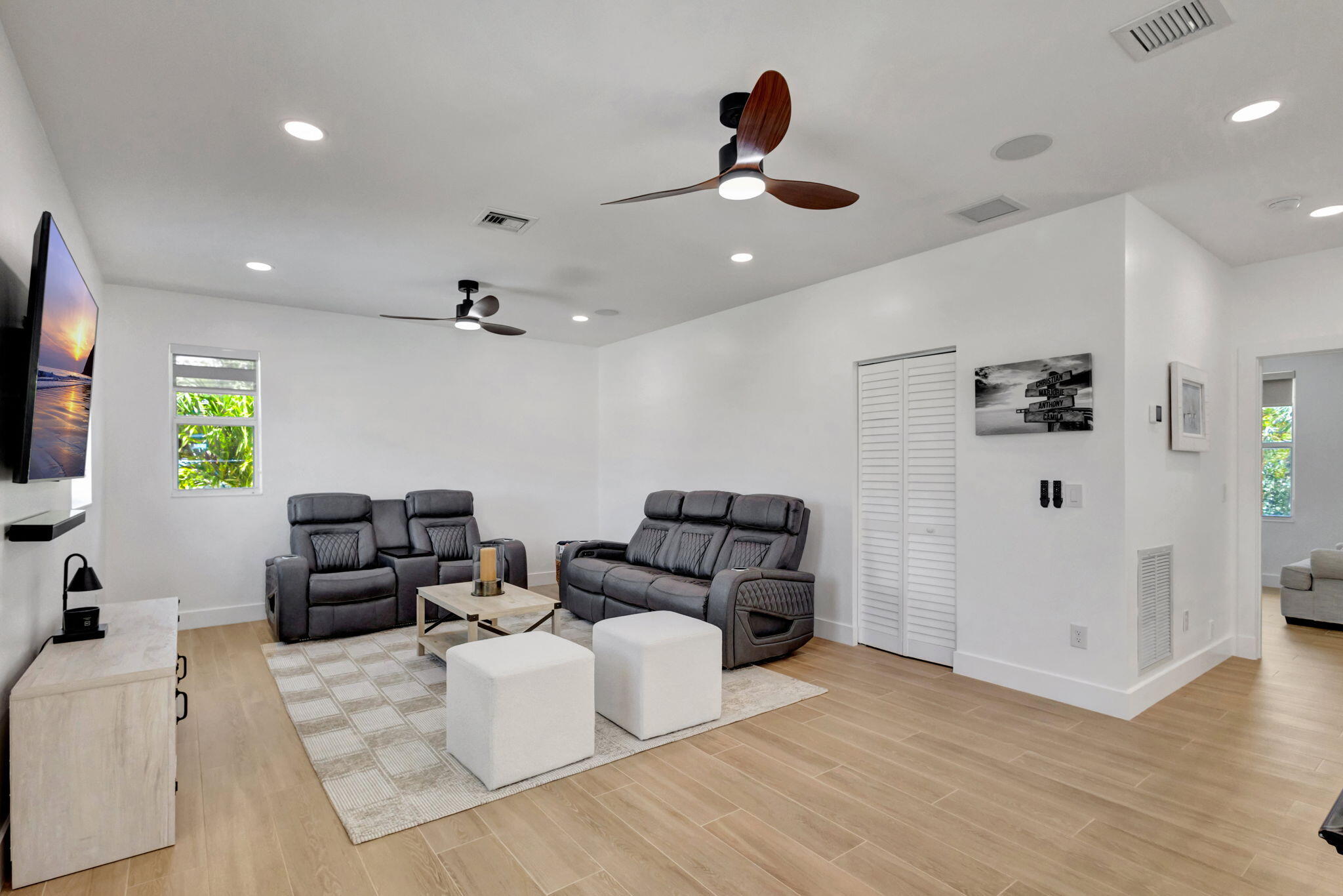12952 Drayton Road North Palm Beach, FL 33408 - Photo 62 of 109 a living room with furniture and a flat screen tv