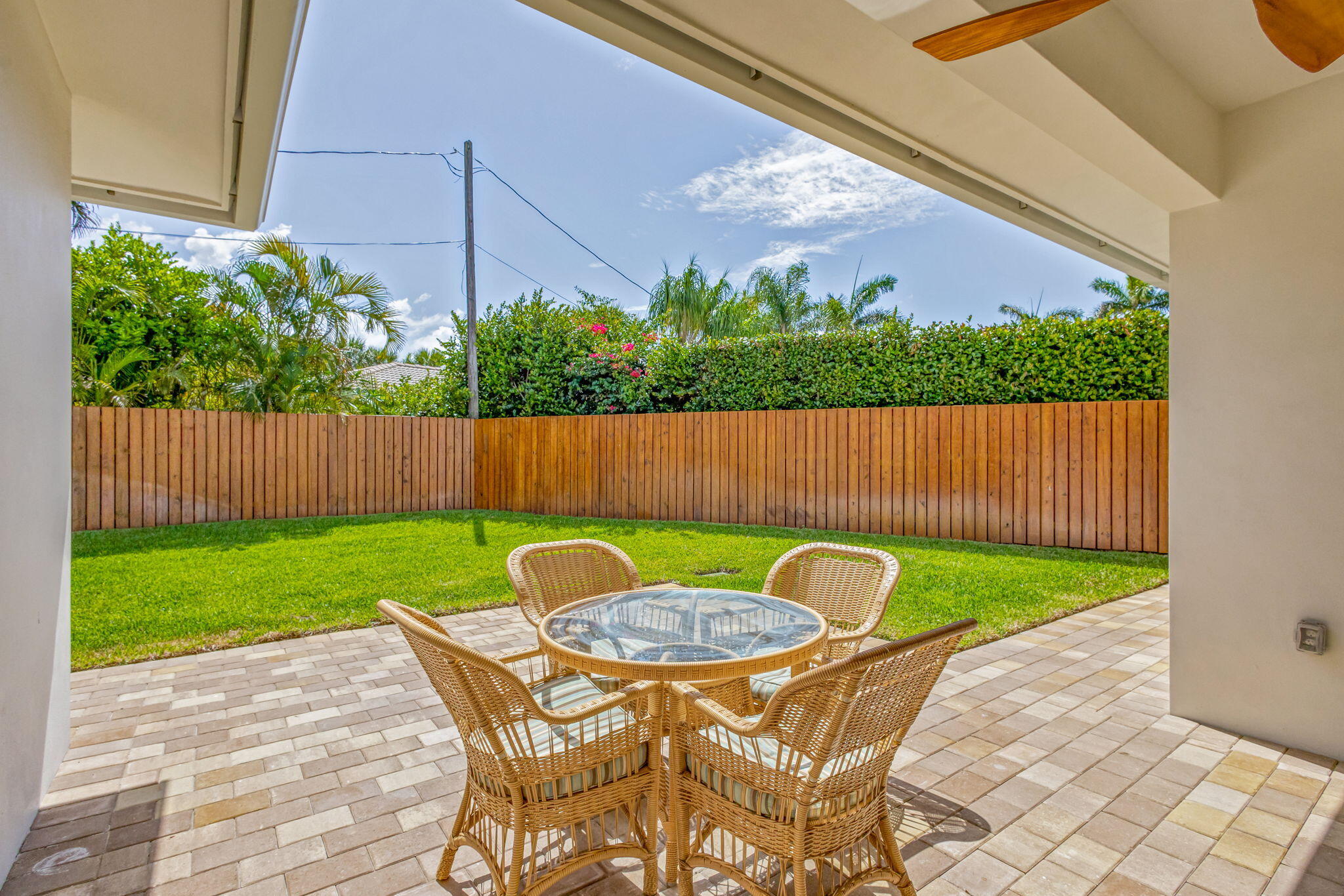 12952 Drayton Road North Palm Beach, FL 33408 - Photo 81 of 109 a backyard of a house with table and chairs