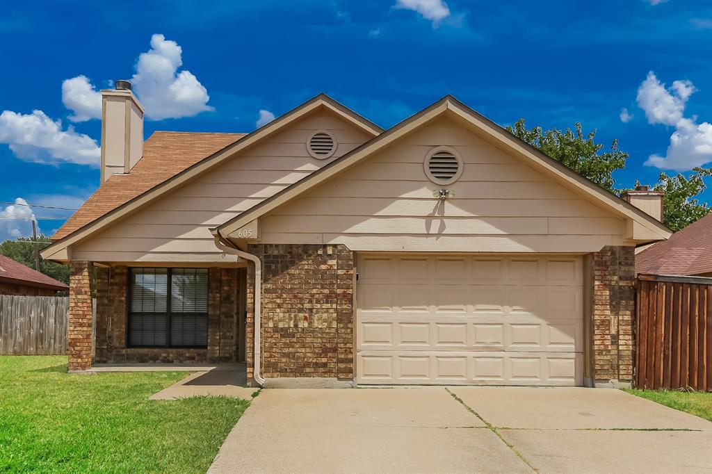 605 Oakland Hills Drive Arlington, TX 76018 - Photo 1 of 1 a front view of a house with garden
