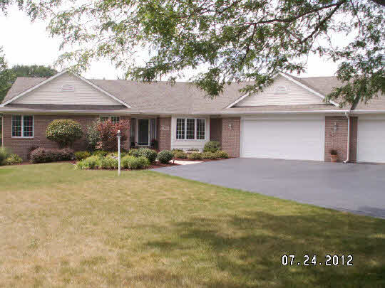11884 Lerwick Road Caledonia, IL 61011 - Photo 1 of 11 a front view of house with yard and green space