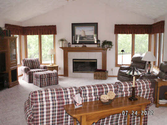 11884 Lerwick Road Caledonia, IL 61011 - Photo 3 of 11 a living room with furniture fireplace and window