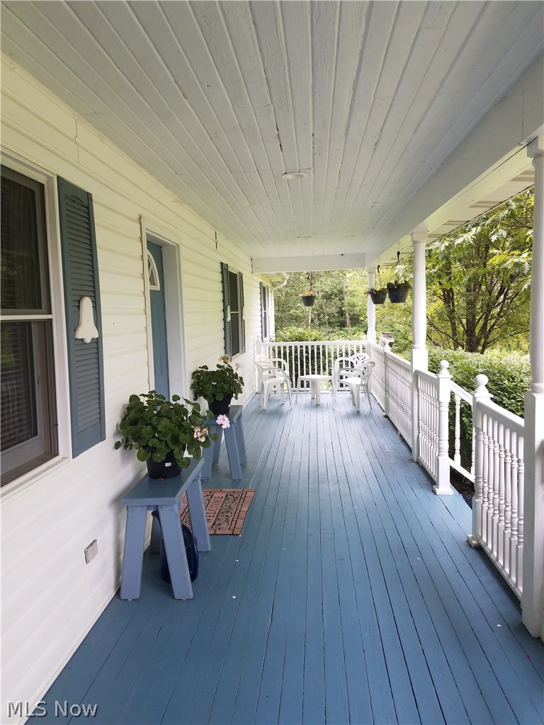 16510 Old State Road Middlefield, OH 44062 - Photo 10 of 35 Picture yourself sitting on the covered front porch watching the cars go by!