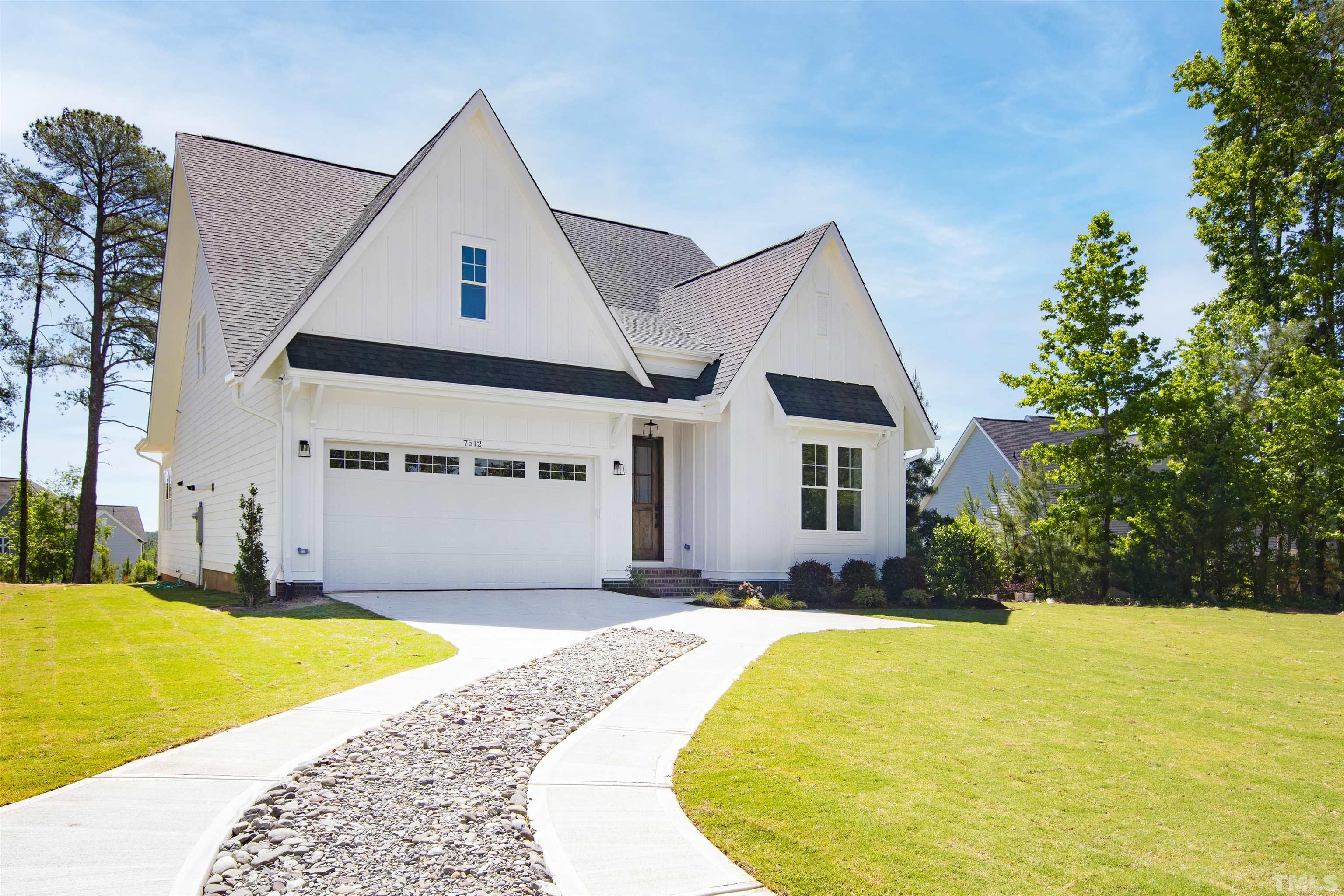 7512 Pinecrest Road Raleigh, NC 27613 - Photo 2 of 47 a front view of house with yard and swimming pool