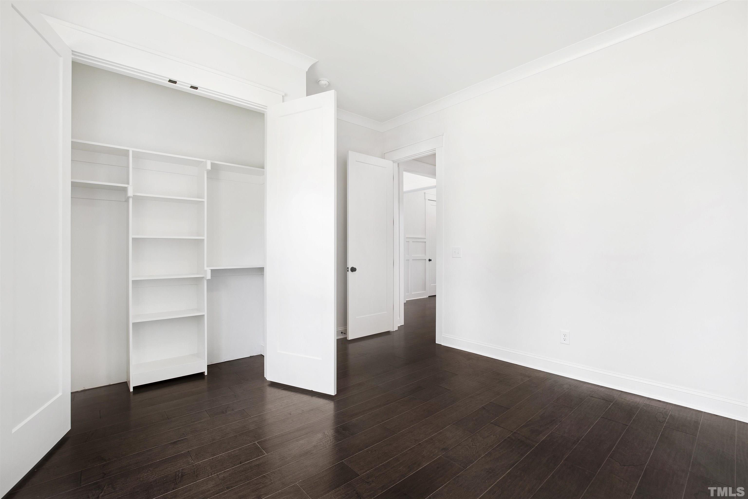 7512 Pinecrest Road Raleigh, NC 27613 - Photo 25 of 47 a view of an empty room with a closet