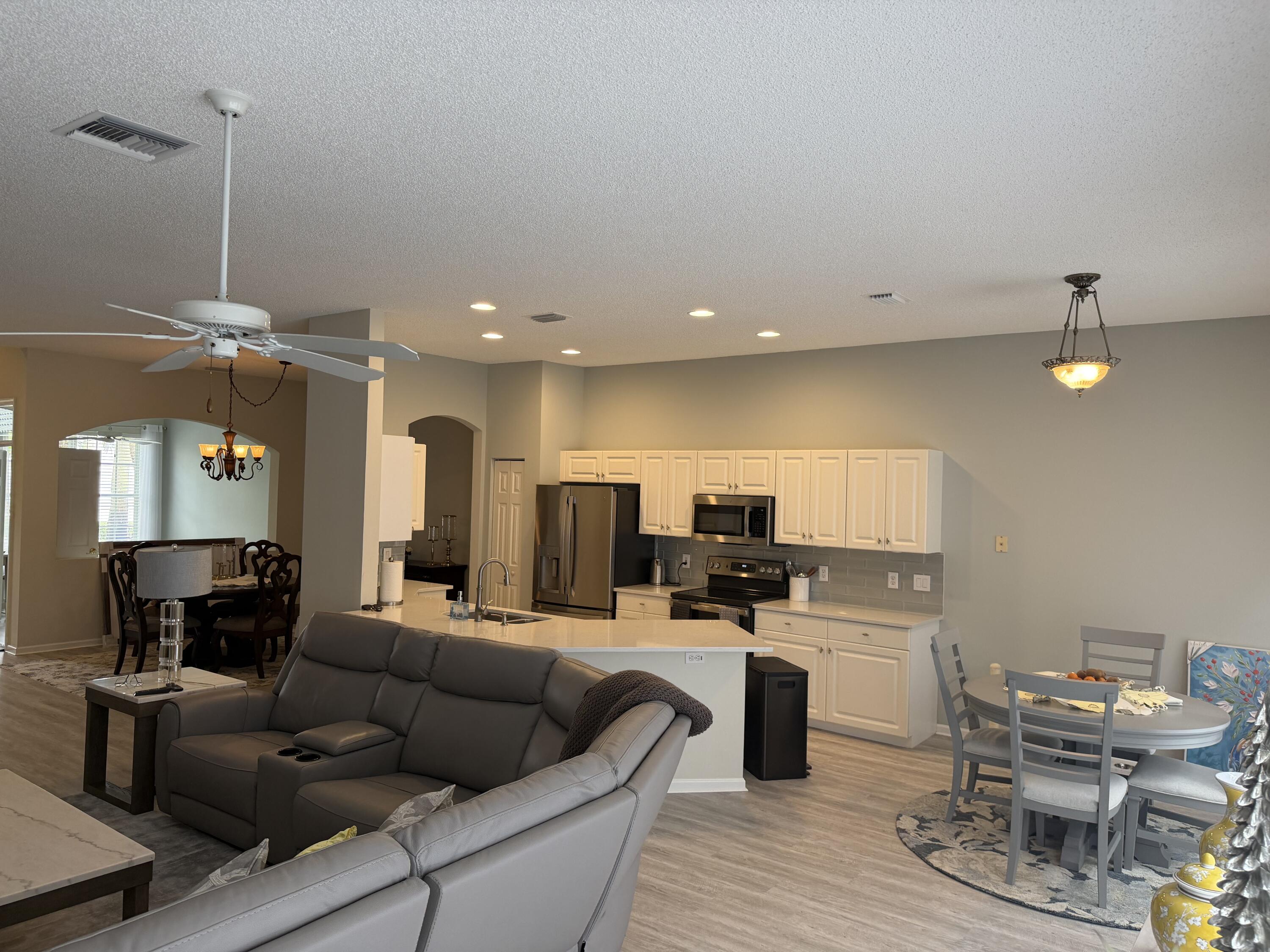 7936 Rockford Road Boynton Beach, FL 33472 - Photo 8 of 14 a living room with furniture and kitchen view