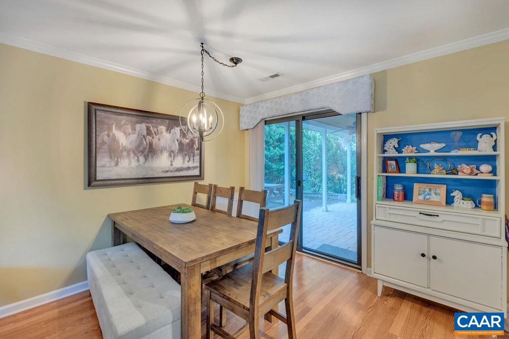 344 Minor Ridge Road Charlottesville, VA 22901 - Photo 11 of 53 a view of a dining room with furniture window and wooden floor