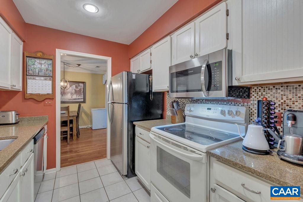 344 Minor Ridge Road Charlottesville, VA 22901 - Photo 15 of 53 a kitchen with stainless steel appliances granite countertop a refrigerator sink and stove