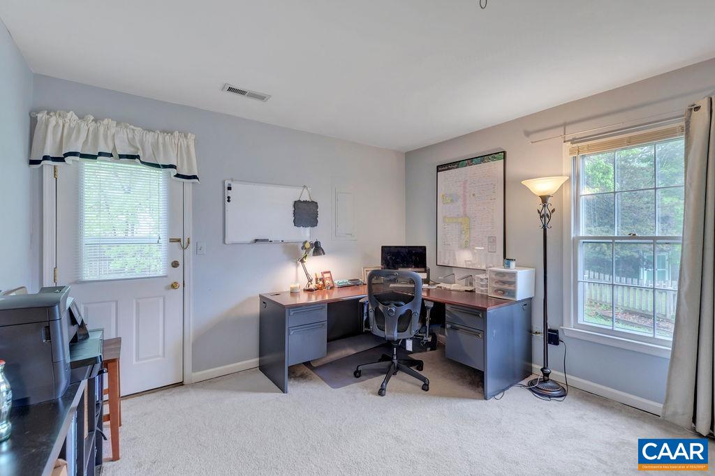 344 Minor Ridge Road Charlottesville, VA 22901 - Photo 21 of 53 a view of a workspace with furniture and a window