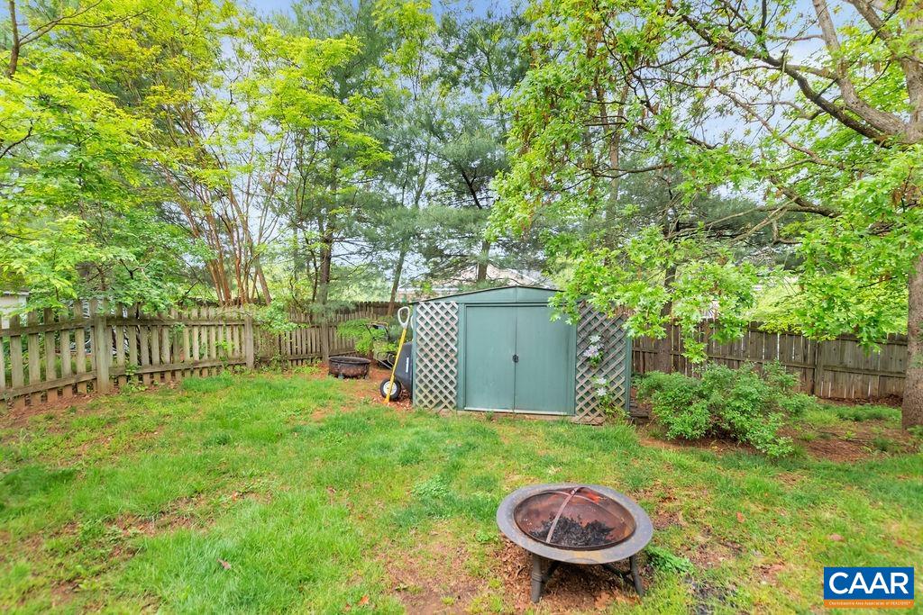 344 Minor Ridge Road Charlottesville, VA 22901 - Photo 24 of 53 a backyard of a house with table and chairs