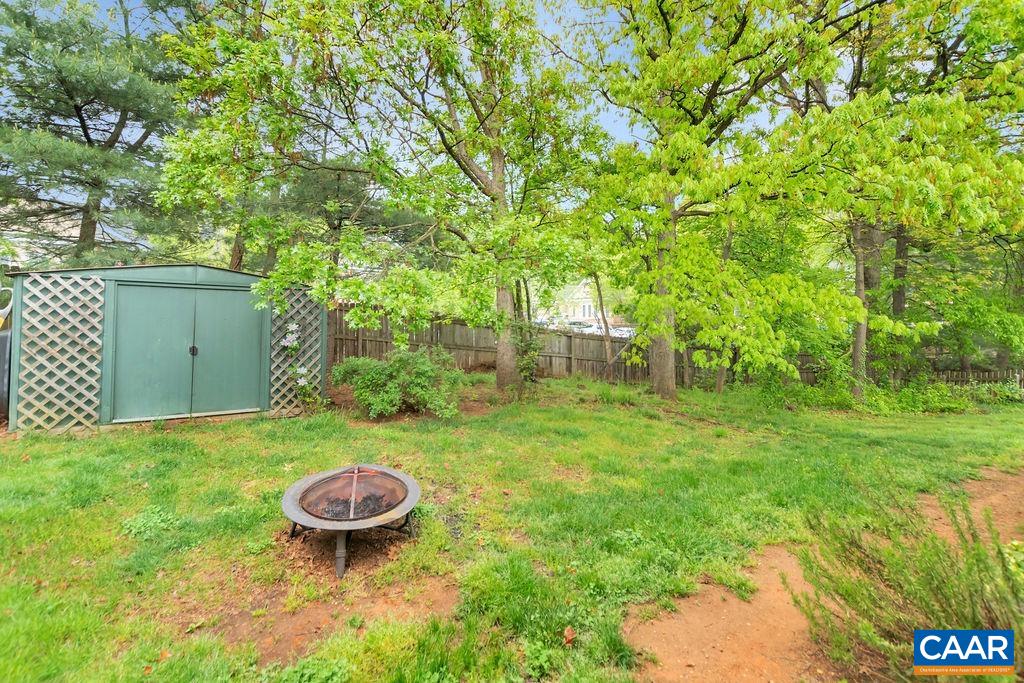 344 Minor Ridge Road Charlottesville, VA 22901 - Photo 25 of 53 a view of a backyard with a table and chairs
