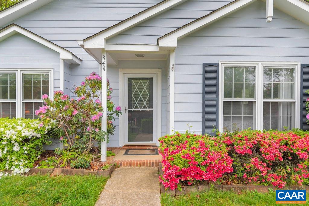 344 Minor Ridge Road Charlottesville, VA 22901 - Photo 4 of 53 a front view of house and yard with beautiful flowers