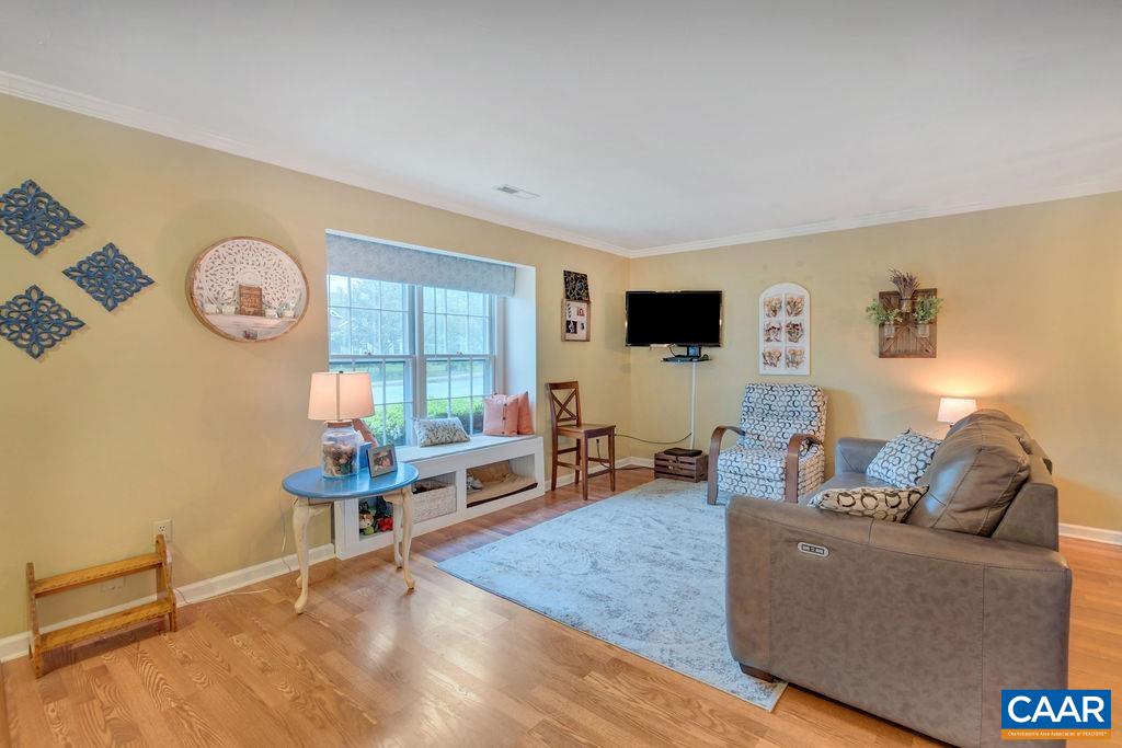 344 Minor Ridge Road Charlottesville, VA 22901 - Photo 7 of 53 a living room with furniture a flat screen tv and a large window