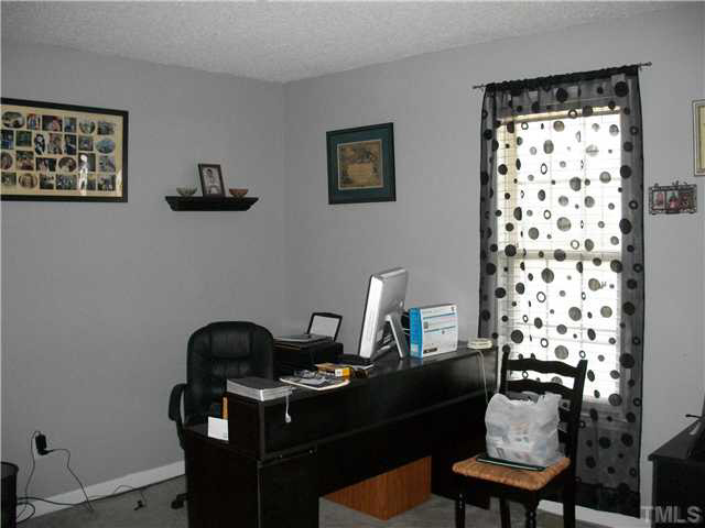 57 Rodney Court Willow Spring, NC 27592 - Photo 12 of 16 a view of a workspace with furniture and a workspace