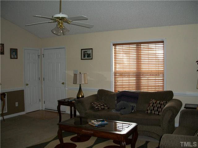 57 Rodney Court Willow Spring, NC 27592 - Photo 5 of 16 a living room with furniture and a window