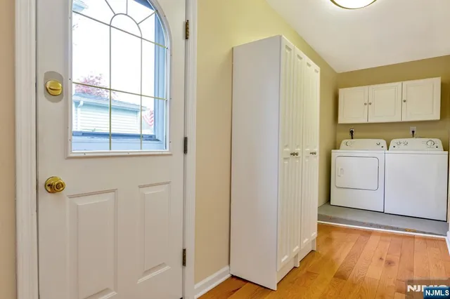 a view of a storage & utility room with a window