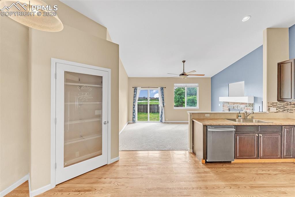 9403 St.George Road Peyton, CO 80831 - Photo 11 of 39 a view of a kitchen with wooden floor and a window