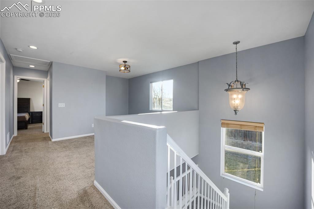 9403 St.George Road Peyton, CO 80831 - Photo 12 of 39 a view of an entryway with wooden floor and cabinet