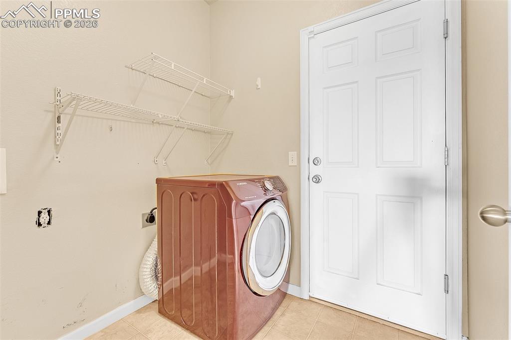 9403 St.George Road Peyton, CO 80831 - Photo 13 of 39 a utility room with dryer and washer