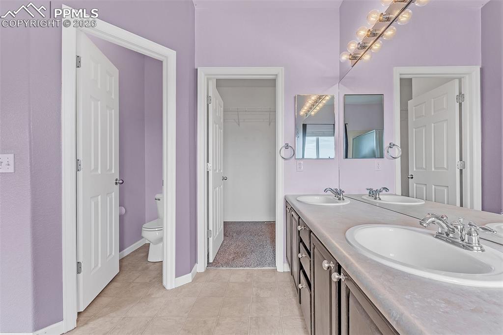 9403 St.George Road Peyton, CO 80831 - Photo 19 of 39 a bathroom with a sink and a mirror