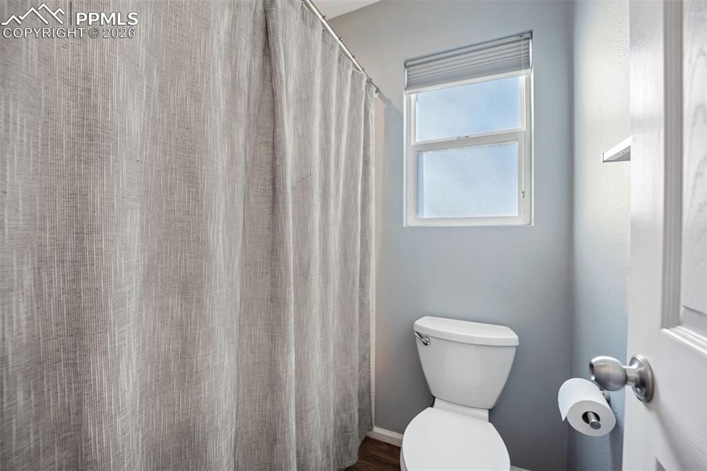 9403 St.George Road Peyton, CO 80831 - Photo 24 of 39 a bathroom with a toilet a sink and a shower