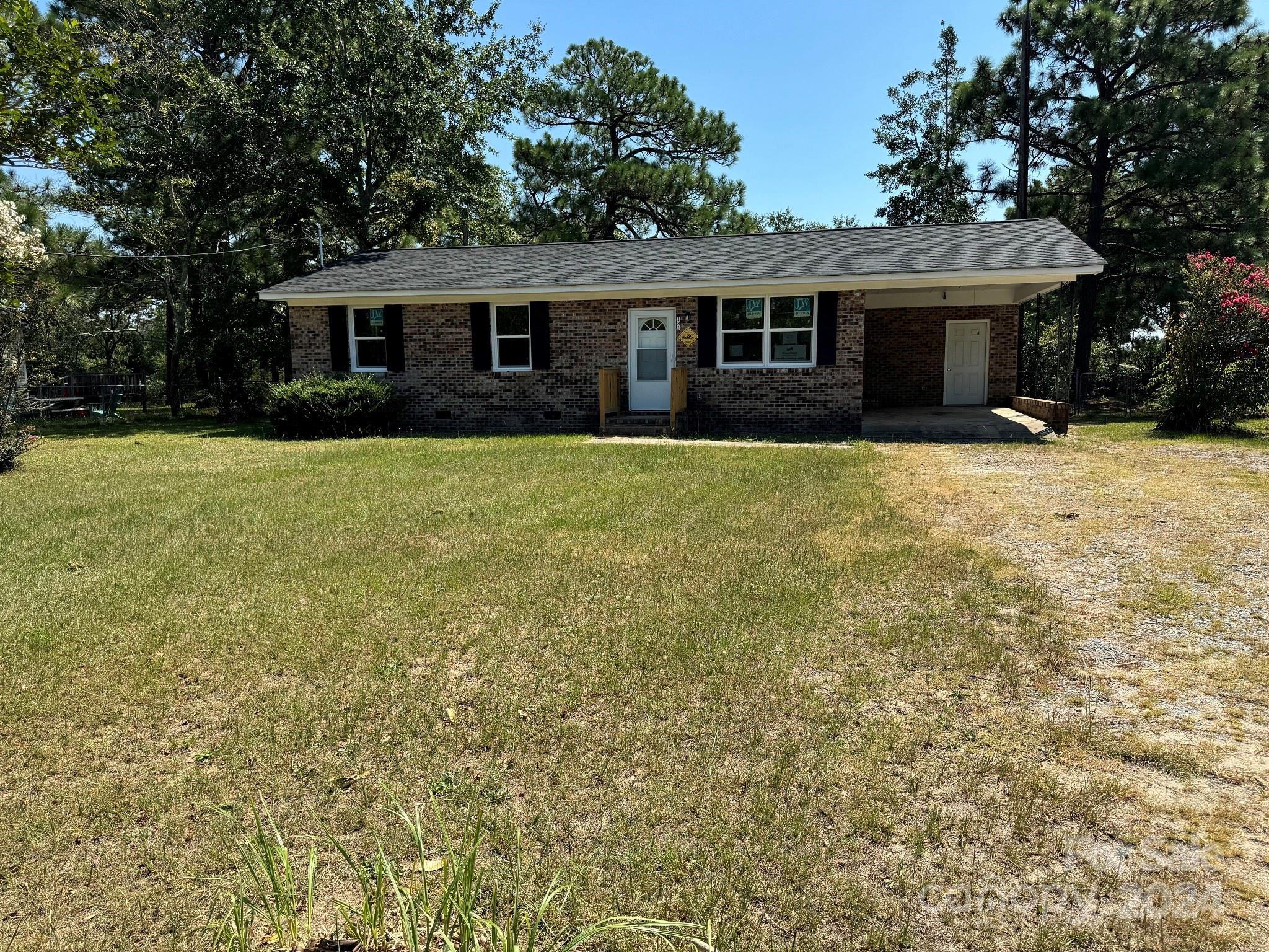 131 Kristy Lane Rockingham, NC 28379 - Photo 1 of 35 front view of a house with a yard