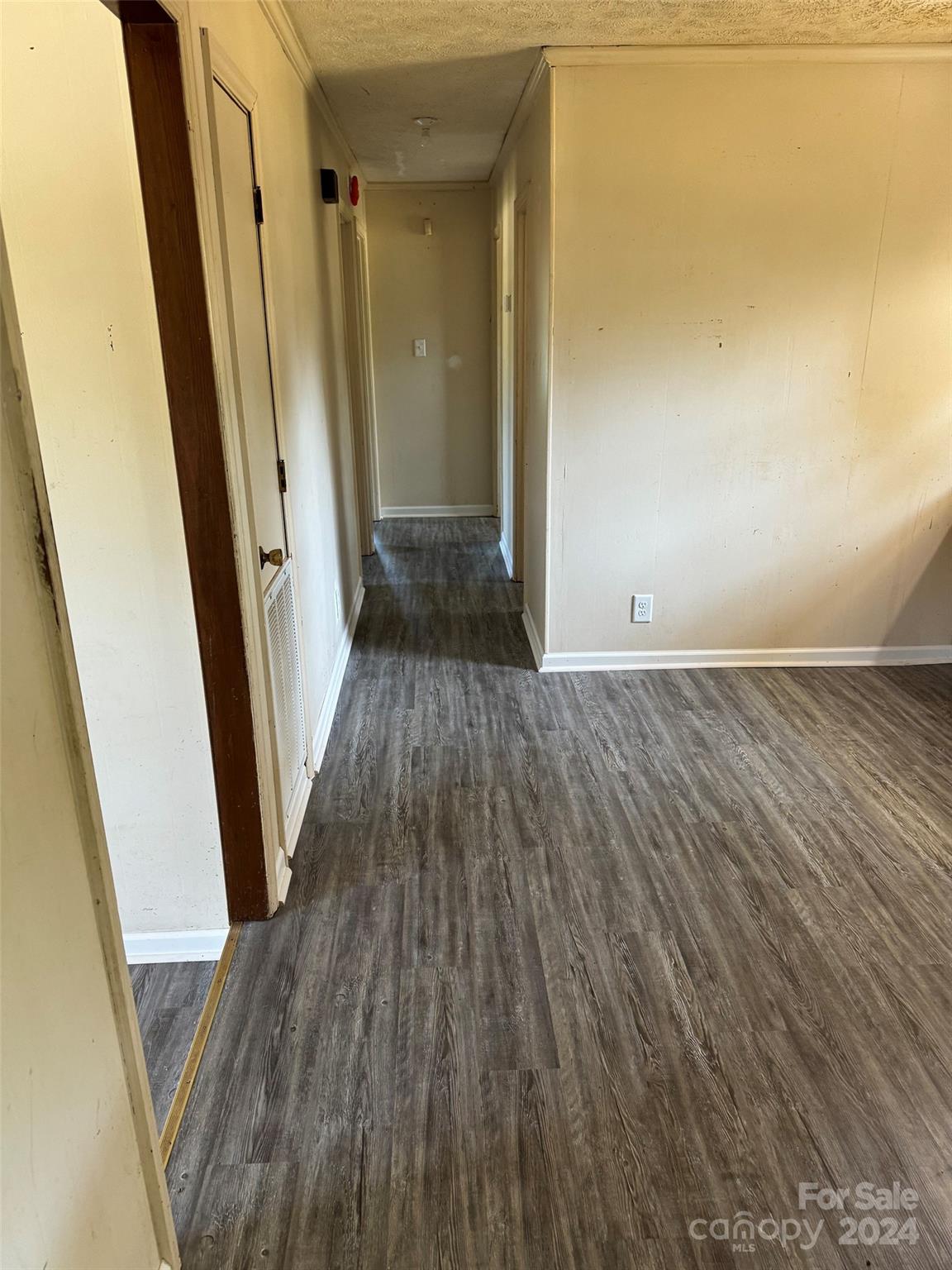 131 Kristy Lane Rockingham, NC 28379 - Photo 17 of 35 a view of a hallway with wooden floor and staircase