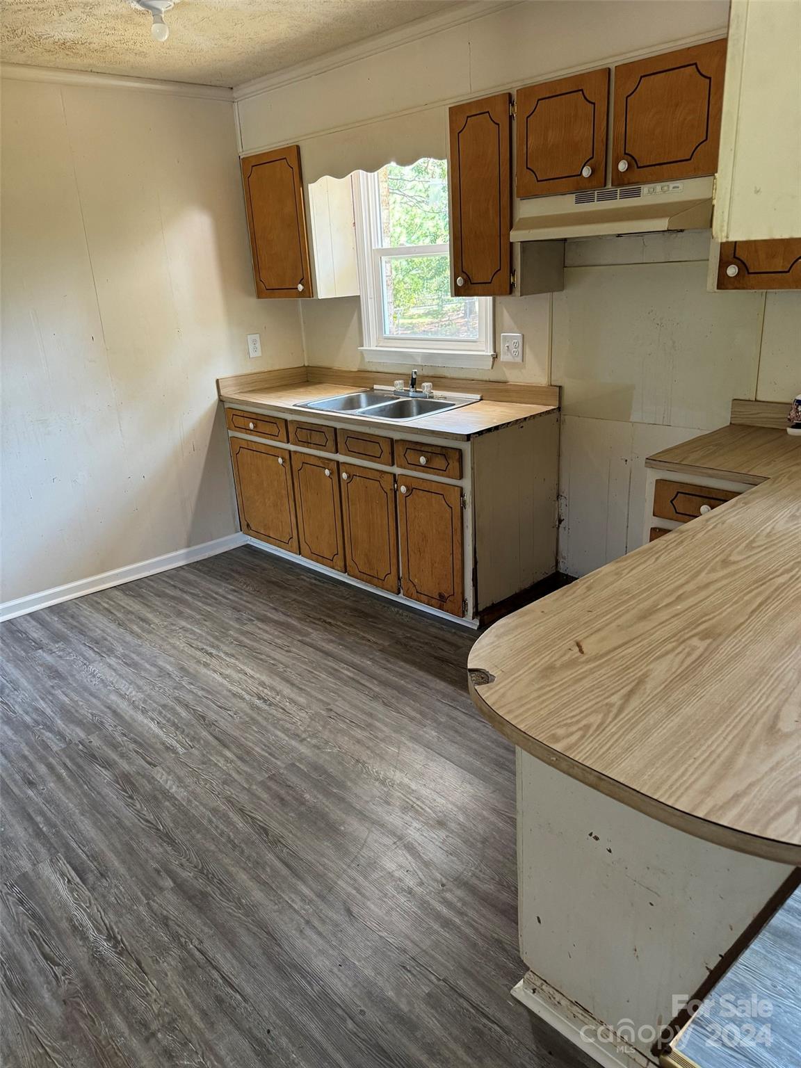 131 Kristy Lane Rockingham, NC 28379 - Photo 18 of 35 a kitchen with a sink and cabinets