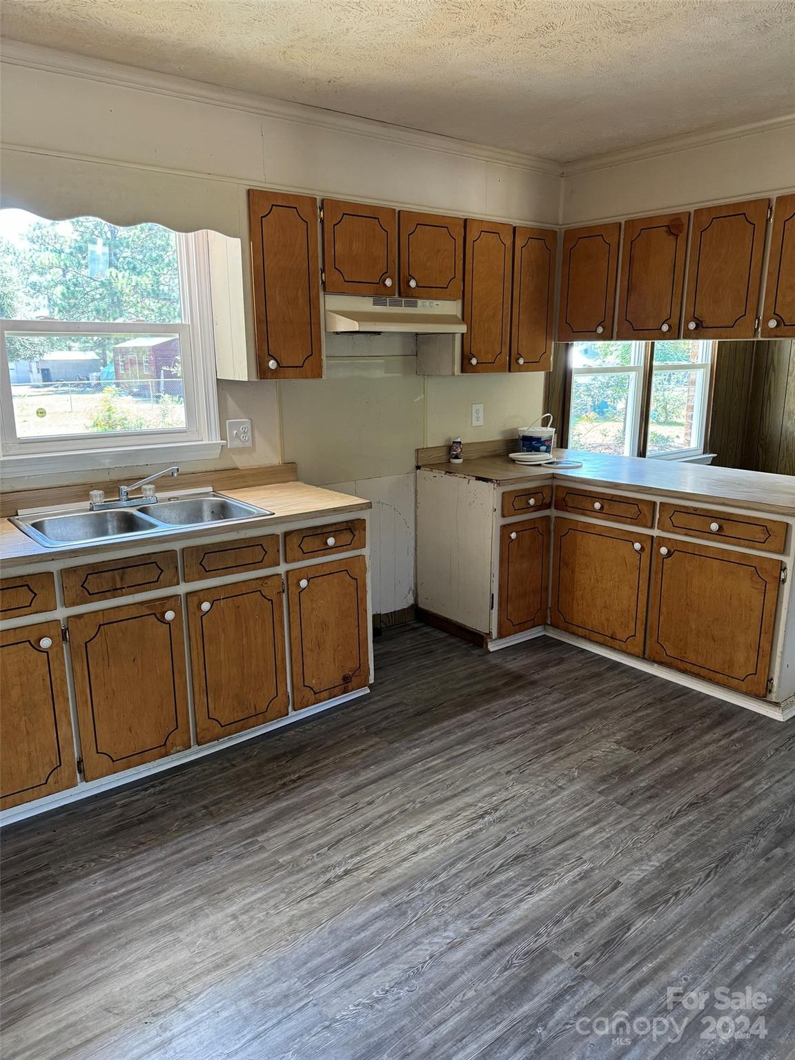 131 Kristy Lane Rockingham, NC 28379 - Photo 19 of 35 a kitchen with a sink cabinets and window