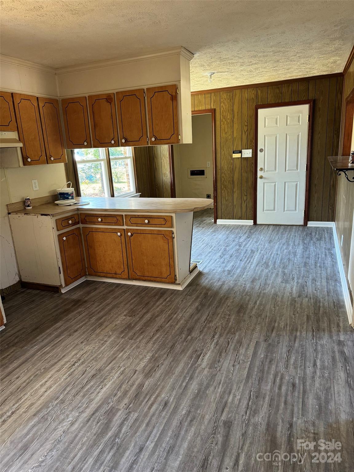 131 Kristy Lane Rockingham, NC 28379 - Photo 20 of 35 a kitchen with granite countertop a sink and wooden cabinets