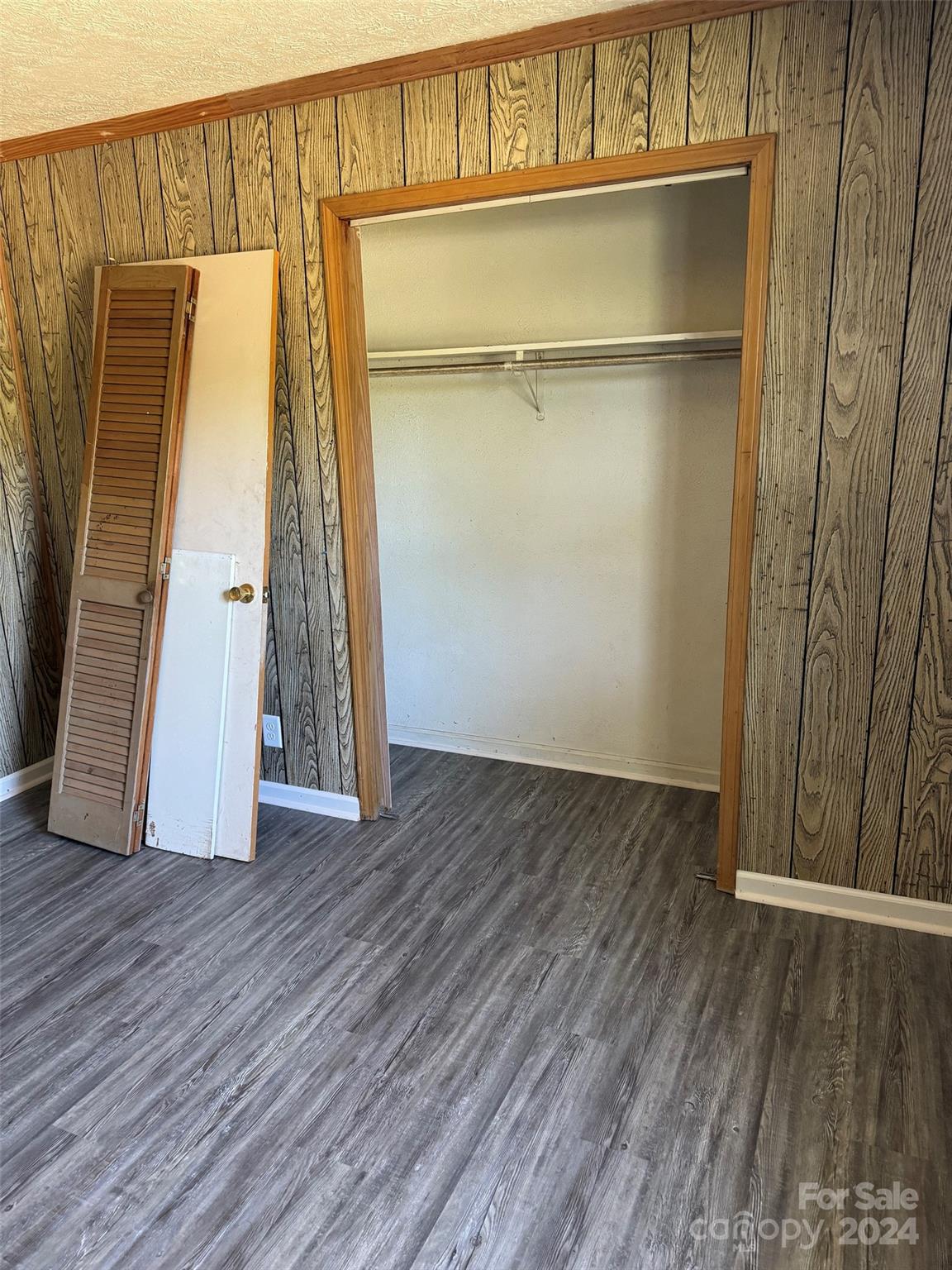 131 Kristy Lane Rockingham, NC 28379 - Photo 27 of 35 a view of an empty room with wooden floor and a window