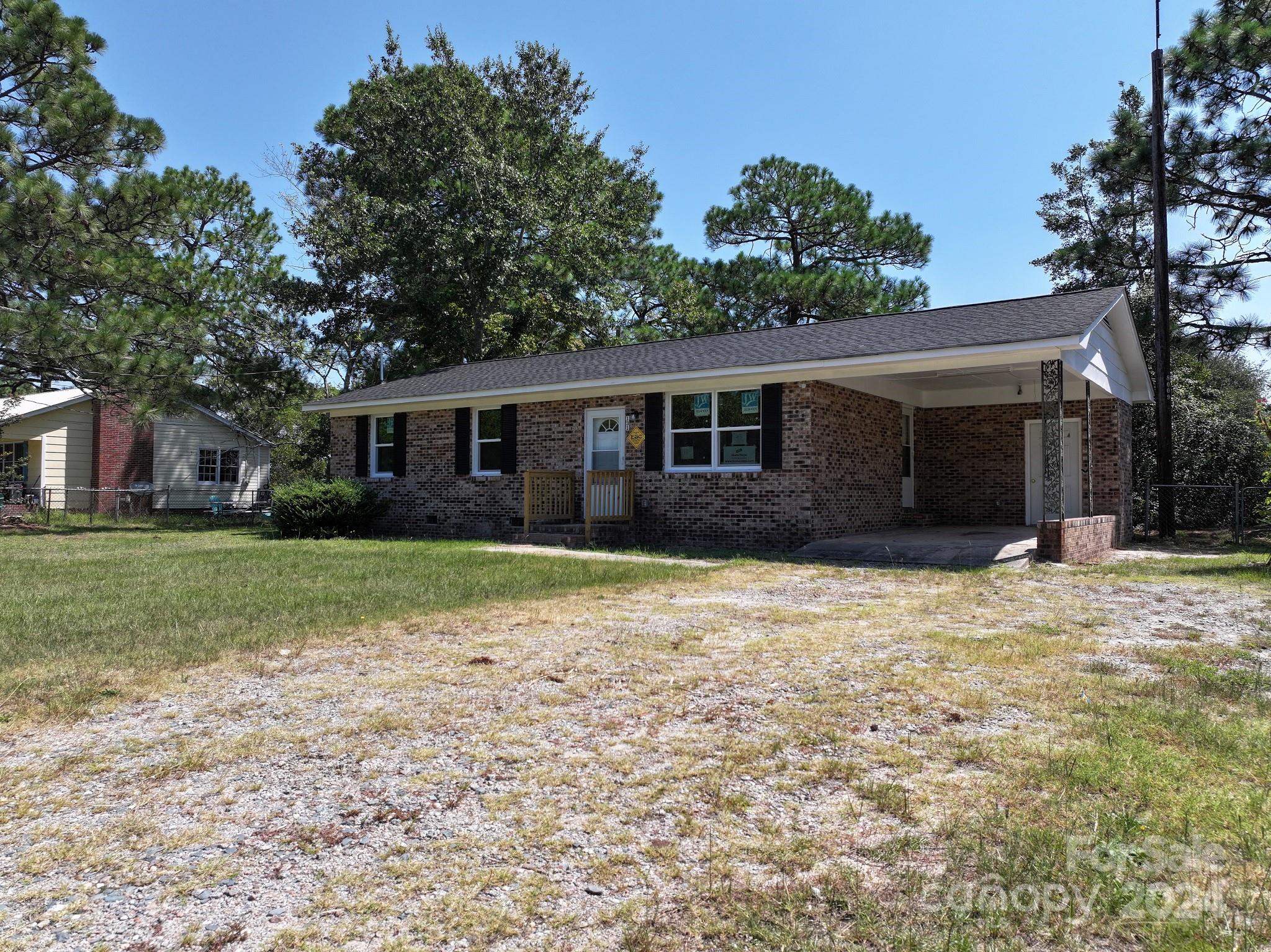 131 Kristy Lane Rockingham, NC 28379 - Photo 3 of 35 a house with trees in the background
