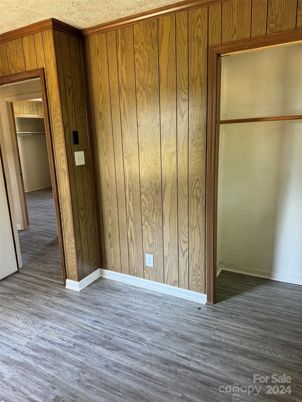 131 Kristy Lane Rockingham, NC 28379 - Photo 32 of 35 a view of a hallway with wooden floor