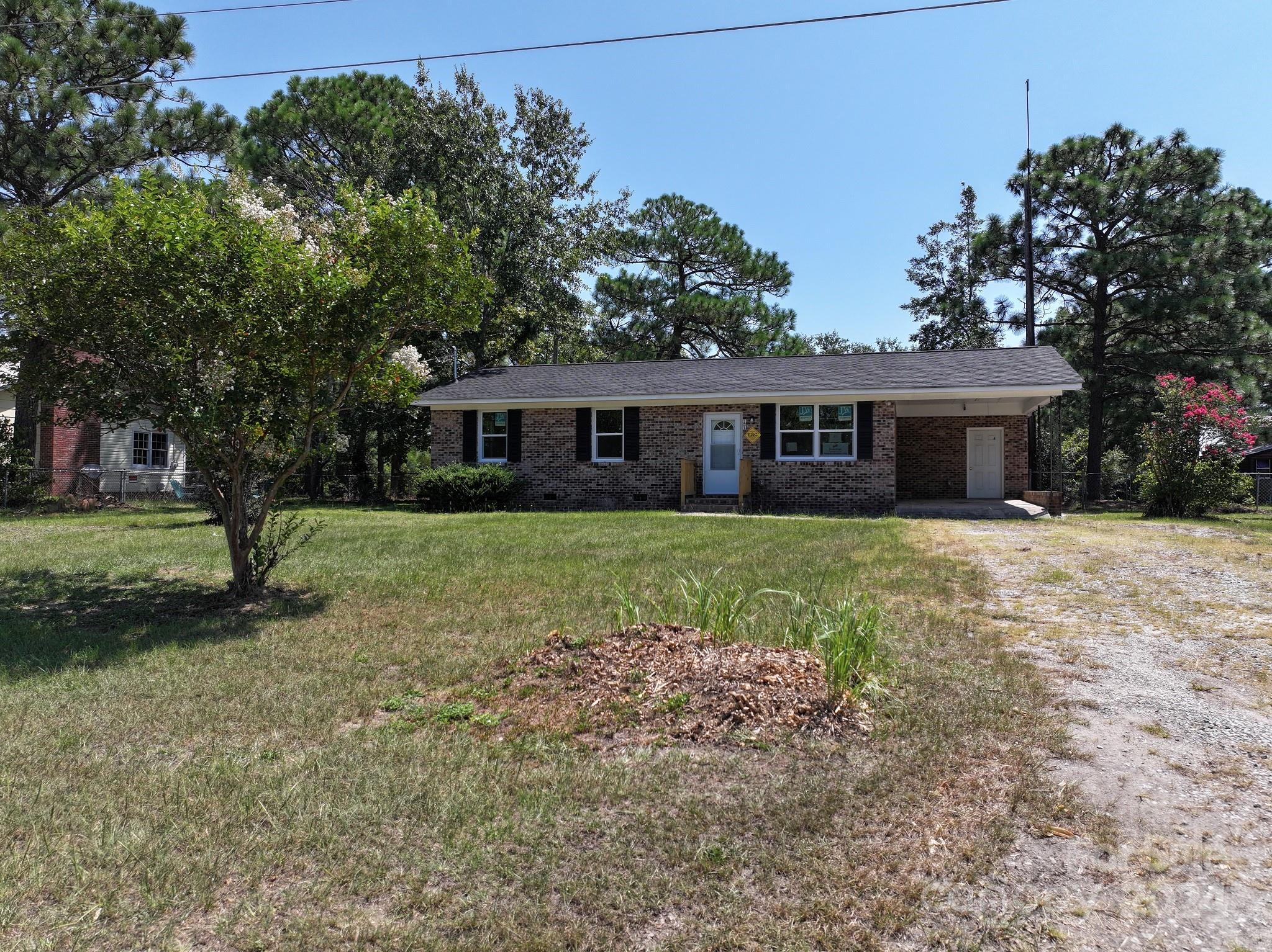 131 Kristy Lane Rockingham, NC 28379 - Photo 33 of 35 a house view with a garden space