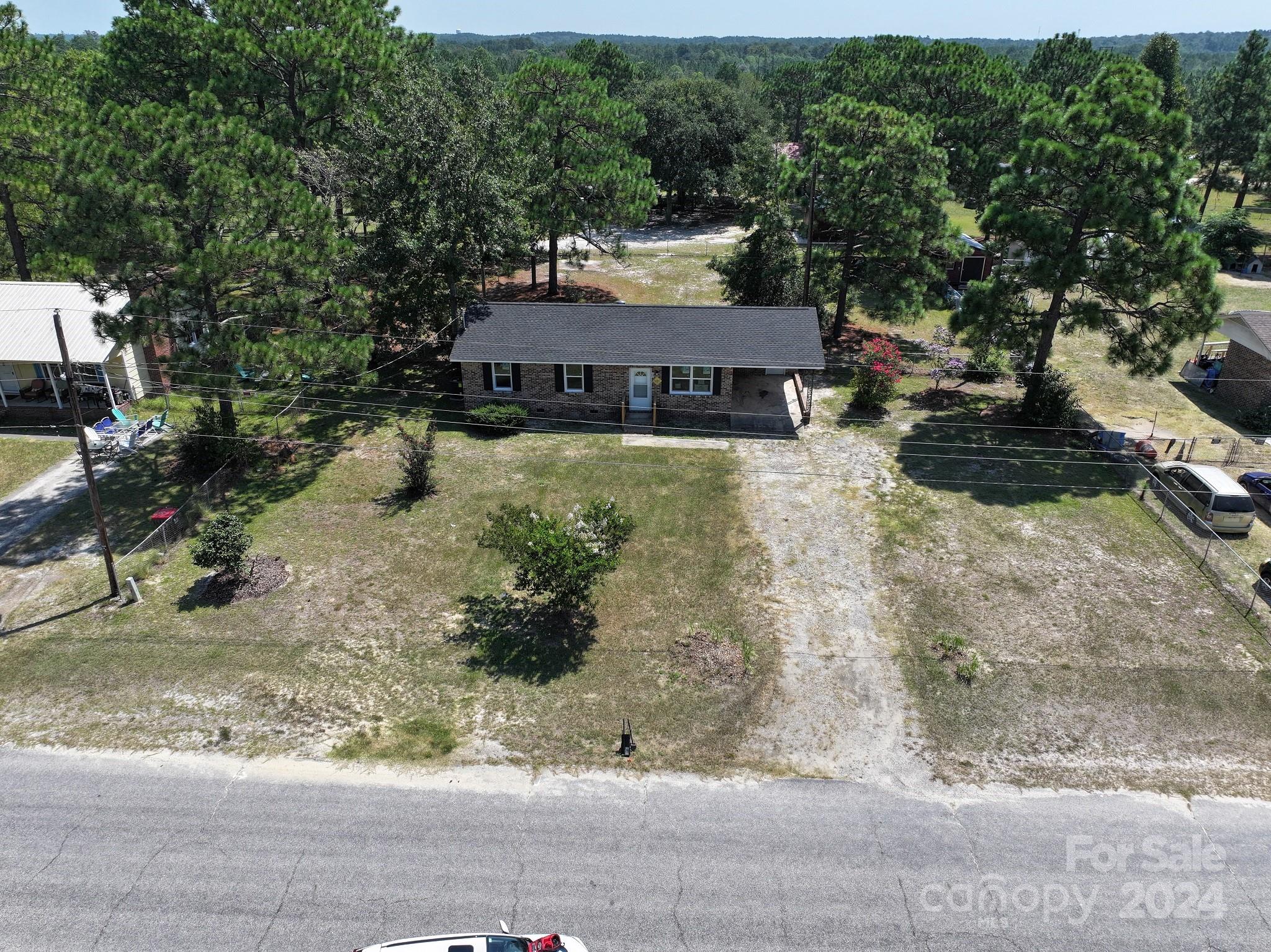 131 Kristy Lane Rockingham, NC 28379 - Photo 34 of 35 a view of a house with a yard