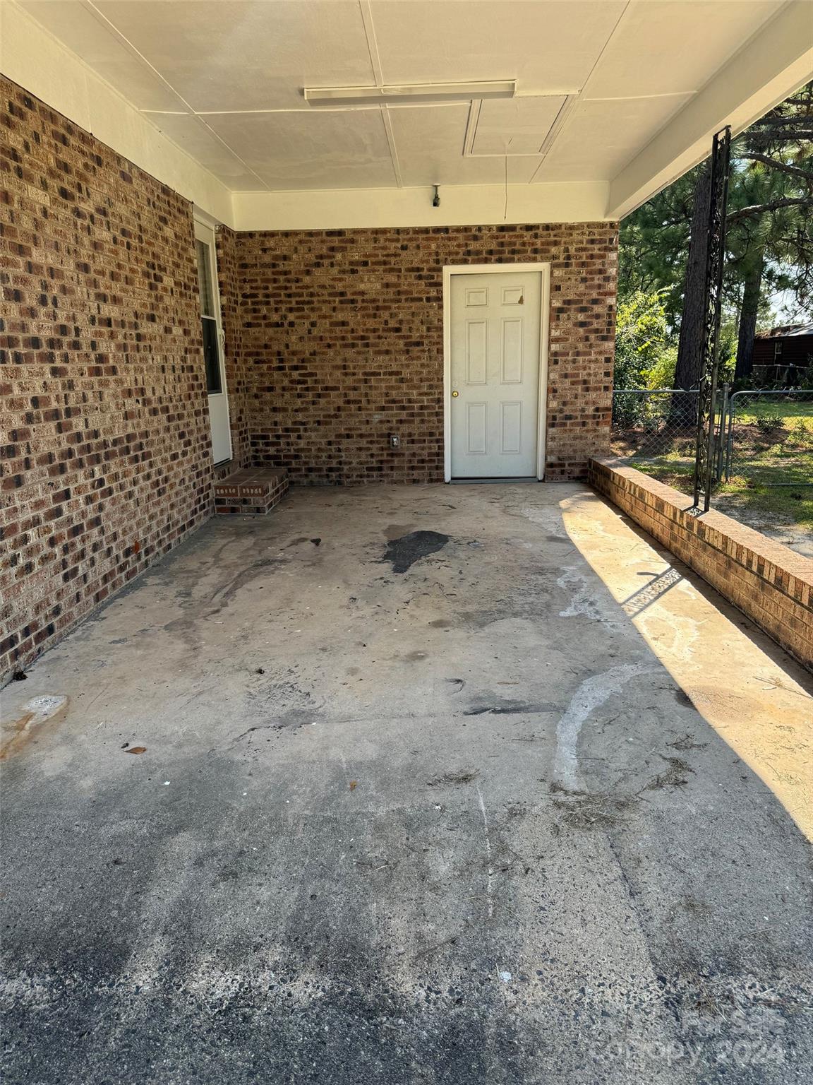 131 Kristy Lane Rockingham, NC 28379 - Photo 4 of 35 a view of a brick house with an outdoor space